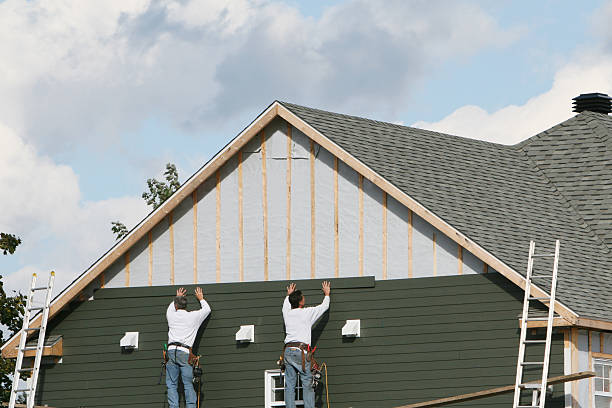 Professional Storm Damage Siding Repair technician working in Reading, PA